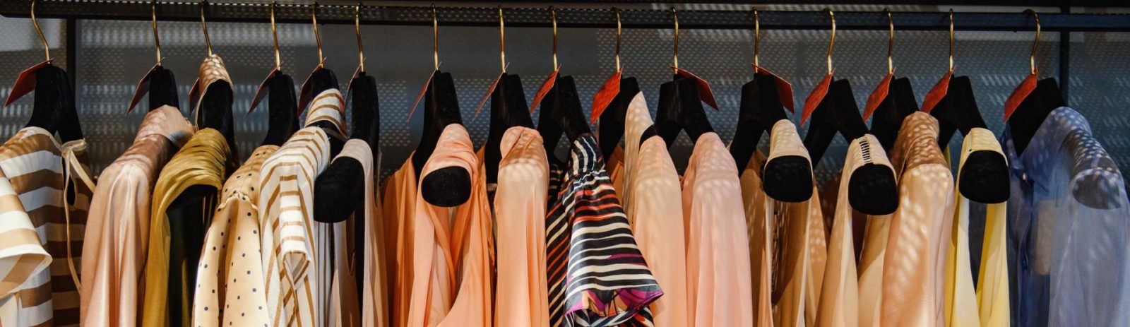 Clothing on hangers in a thrift store