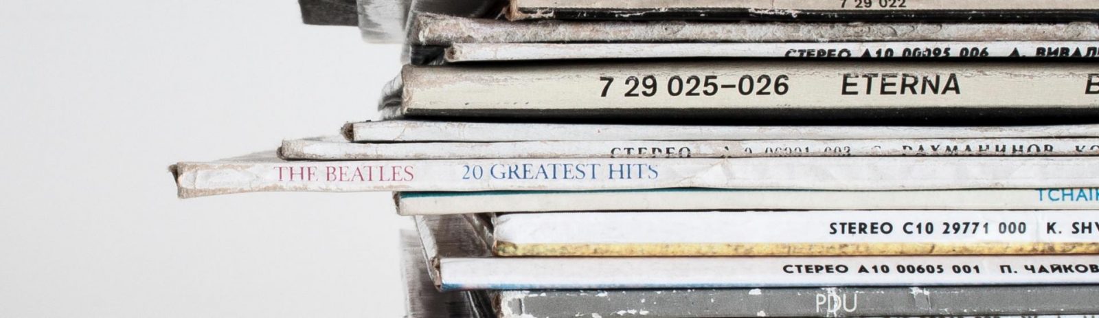 A stack of vinyl records including the Beatles Greatest Hits and Eterna.